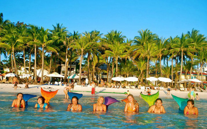 Swimming school teaches you how to be a mermaid--top emoticon