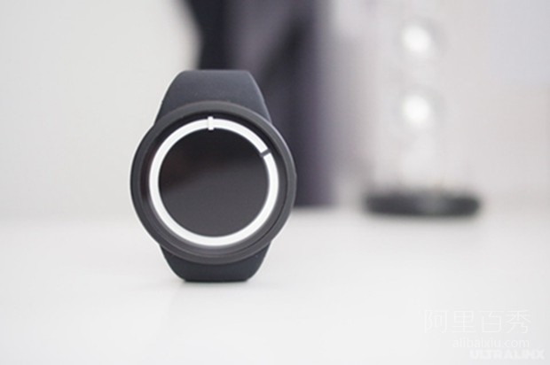 The ZIIIRO Eclipse watch emits neon blue light in the dark night, simple and sty